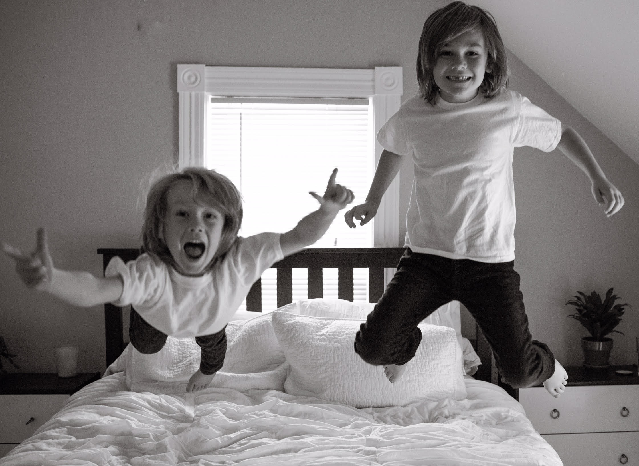 kids jumping on the bed